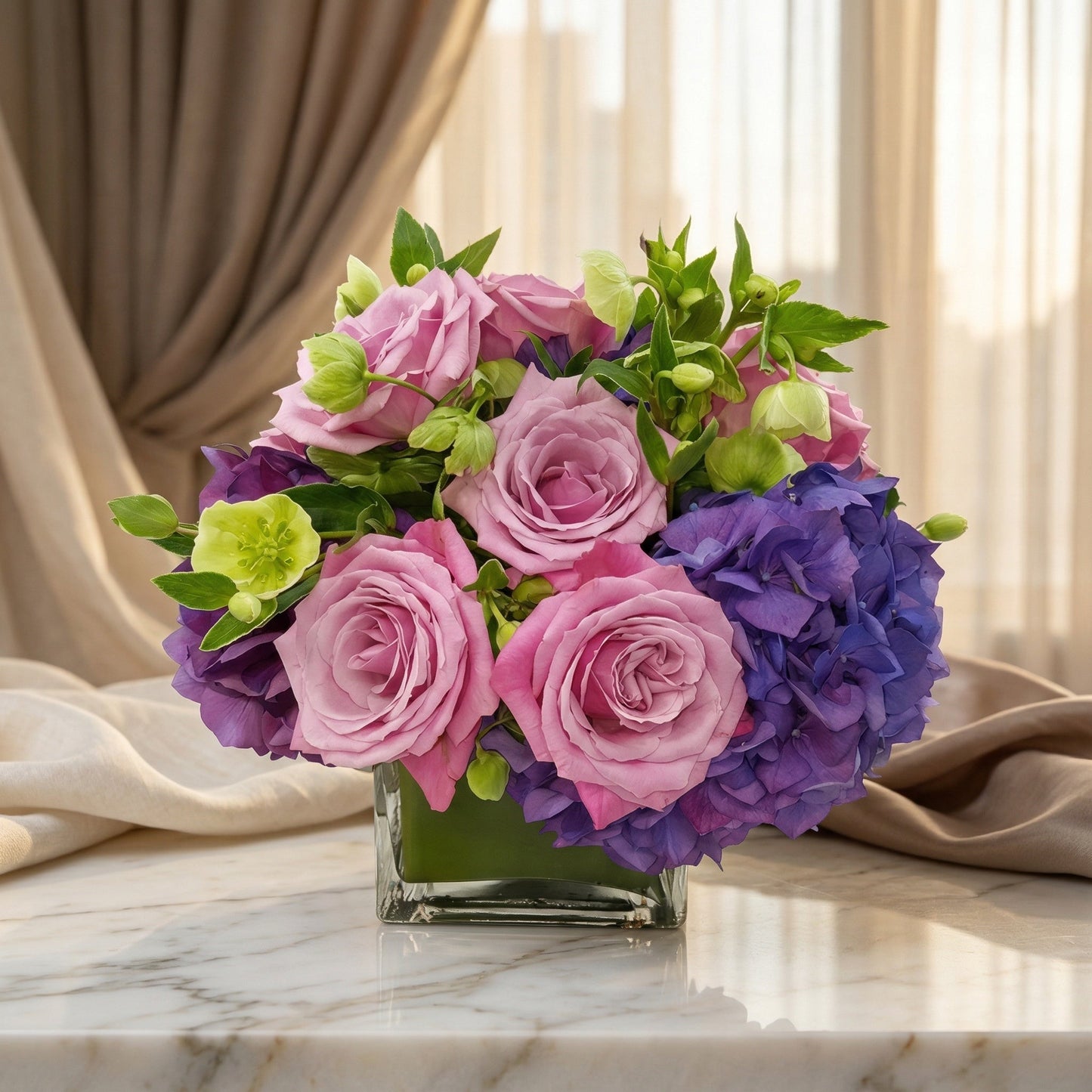 Pink roses and purple hydrangeas in a square glass vase on a marble table - TJ Flowers NYC