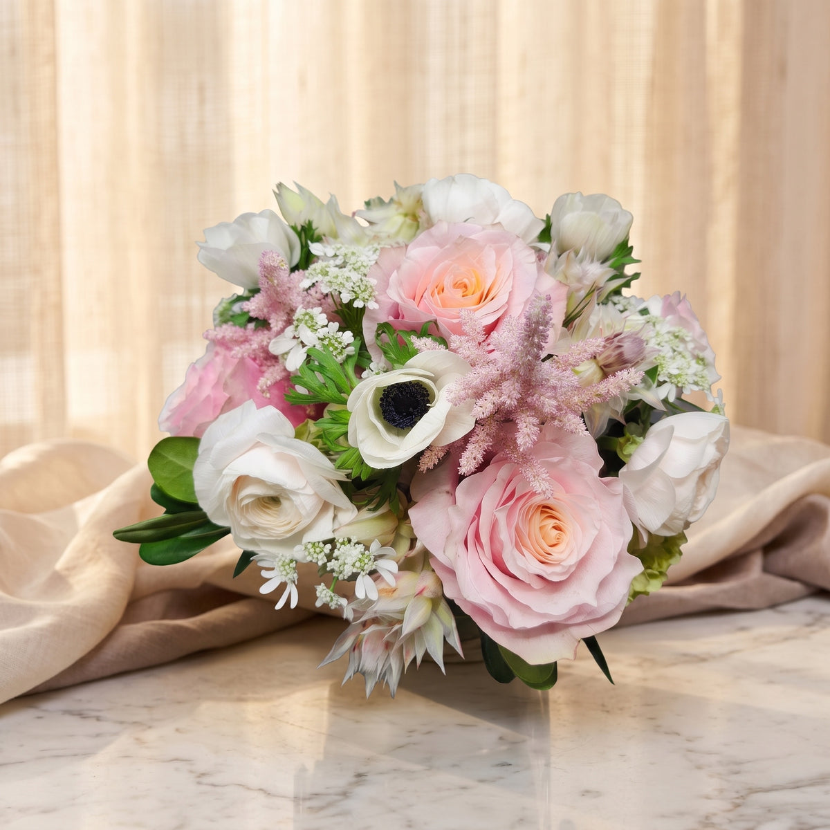 Blush pink roses with white anemones, white ranunculus and pink astilbe - TJ Flowers NYC