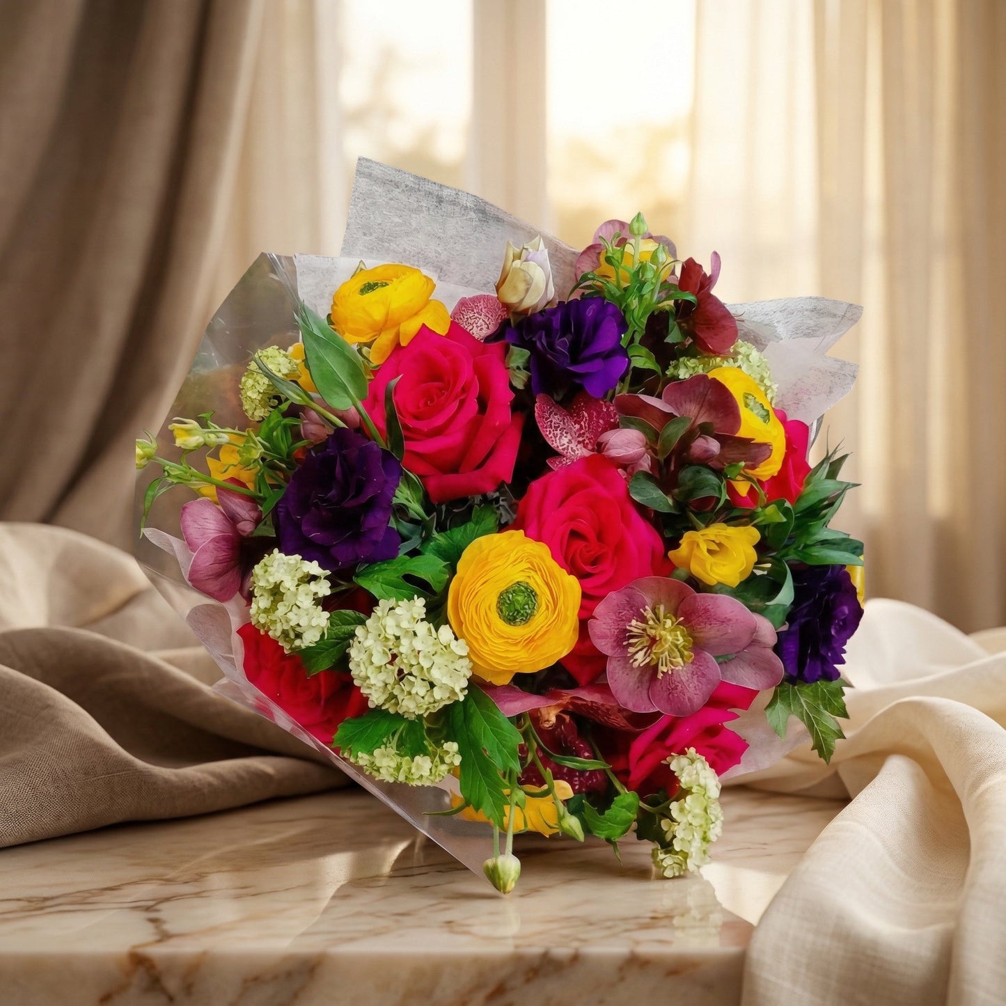 Vibrant bouquet with hot pink roses, yellow ranunculus, and purple flowers in clear wrap - TJ Flowers NYC