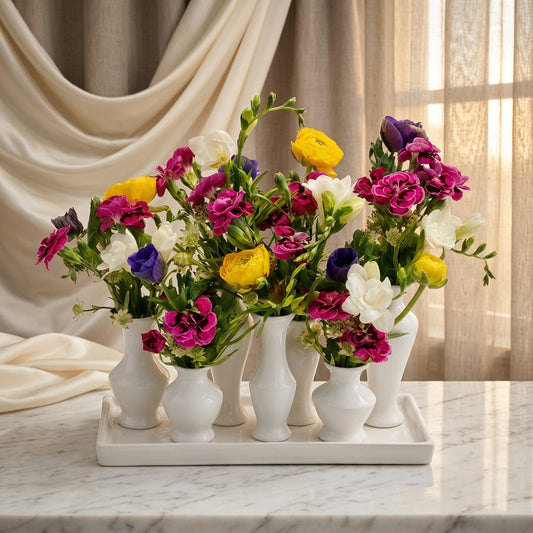Colorful mixed flowers in multiple small white vases on a tray - TJ Flowers NYC