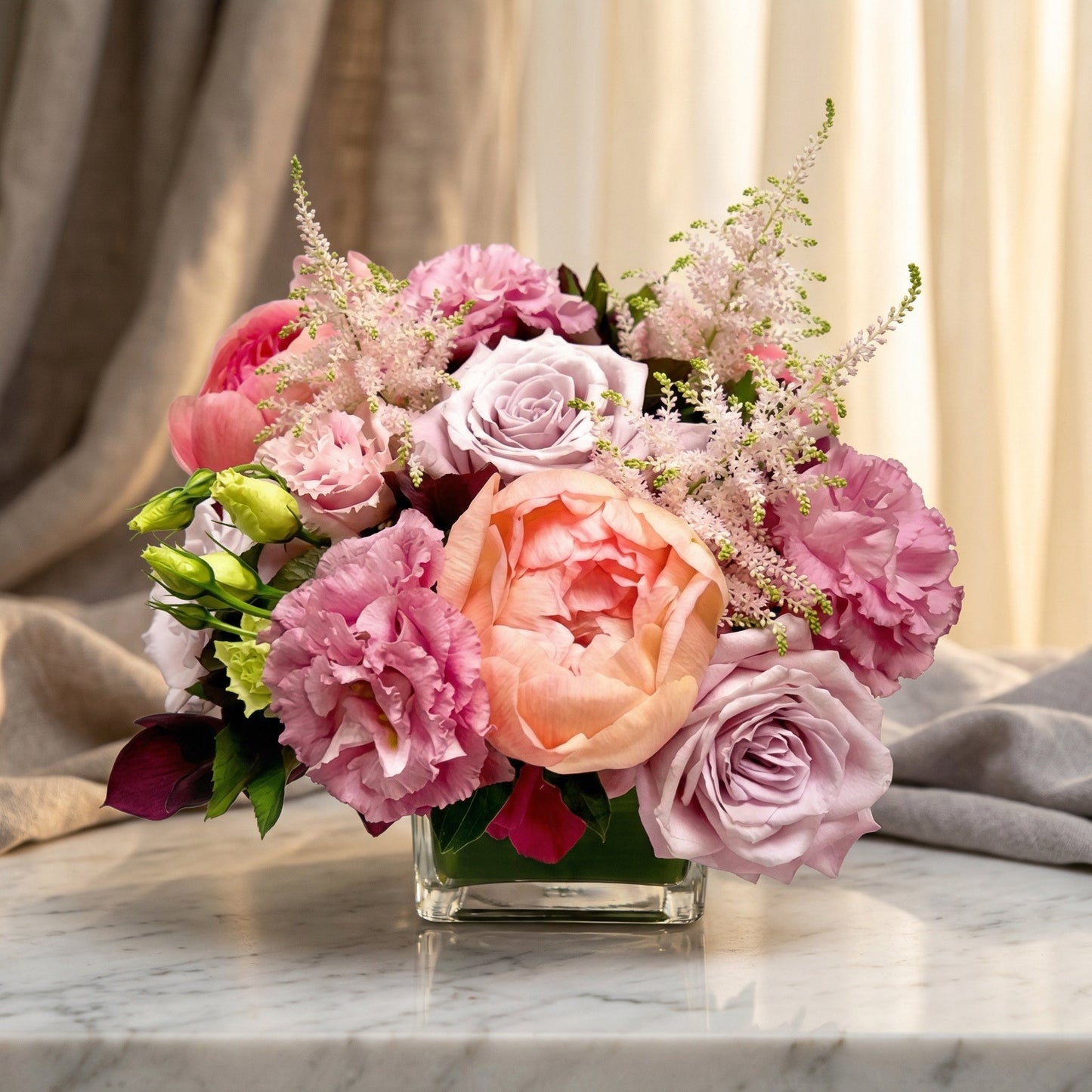 Pastel bouquet with roses, peonies, and astilbe in a square glass vase - TJ Flowers NYC