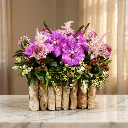 Purple Vanda orchids and pink astilbe in a rustic birch log vase - TJ Flowers NYC