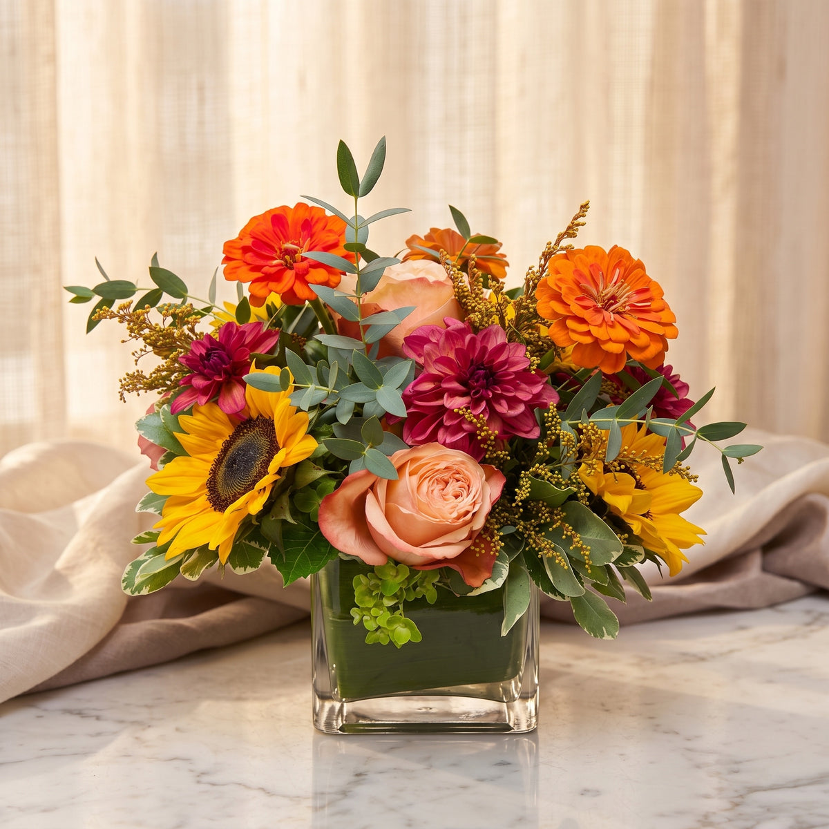 Sunflowers with orange zinnias, peach roses, magenta dahlias and golden solidago - TJ Flowers NYC