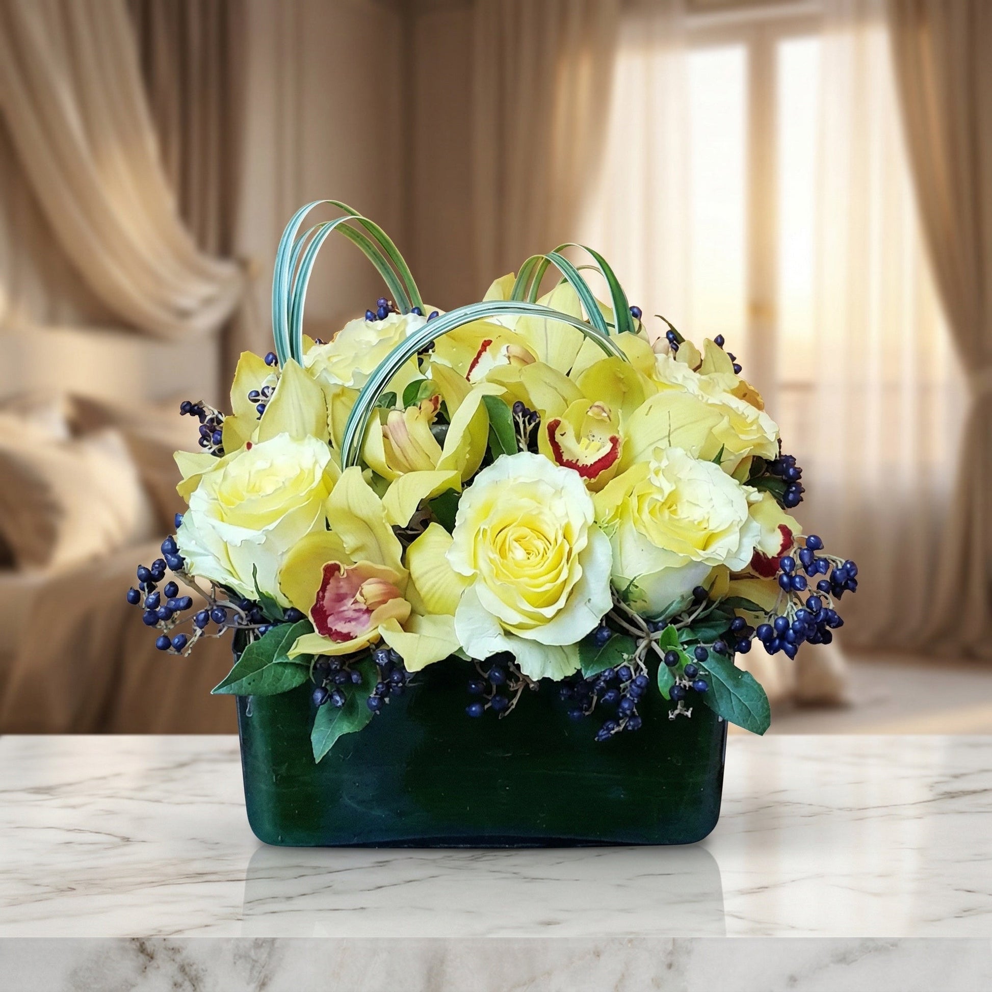 Yellow roses and cymbidium orchids with blue berries in a green glass vase - TJ Flowers NYC