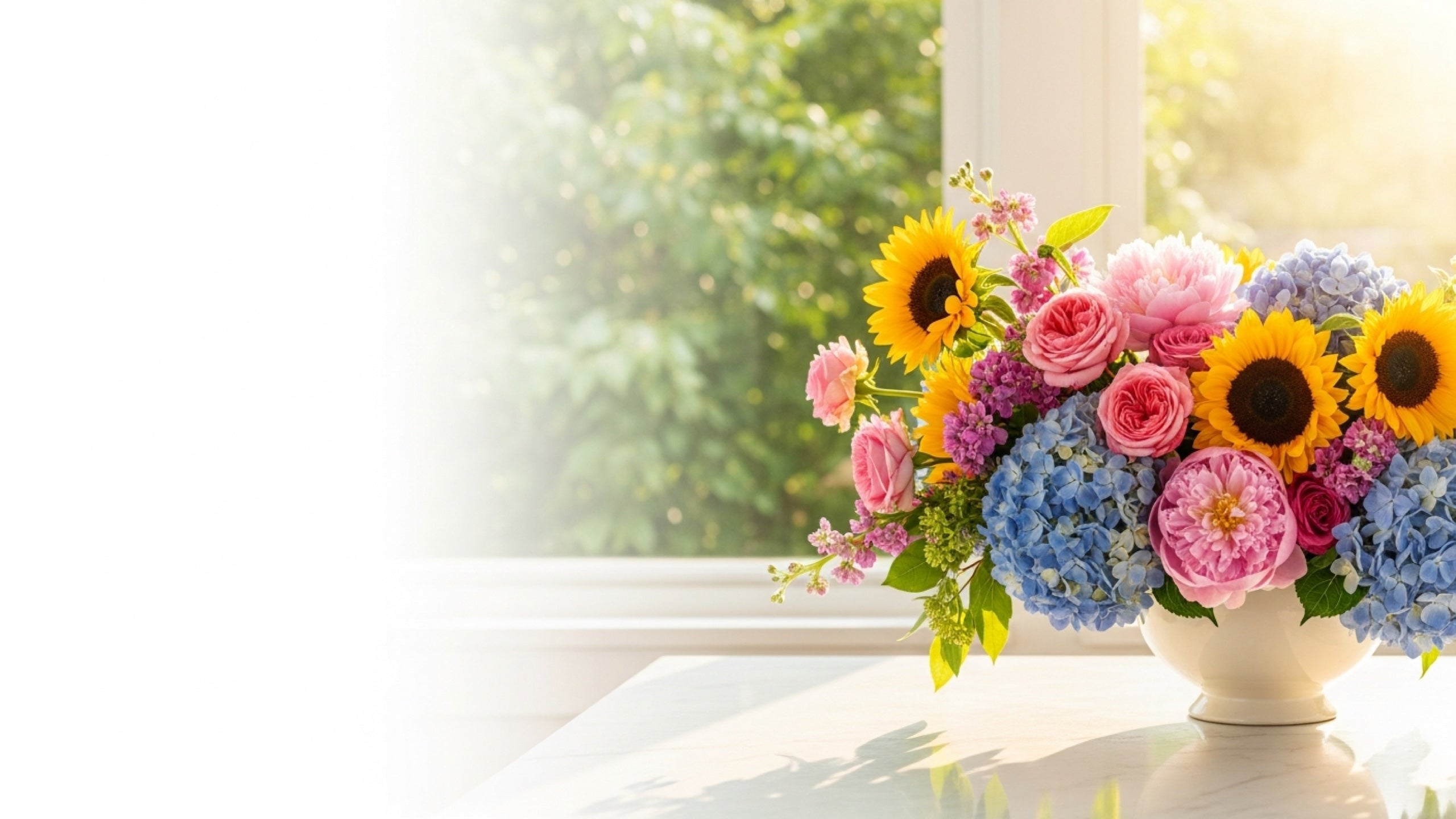 Summer flower arrangement with sunflowers, hydrangea and garden roses